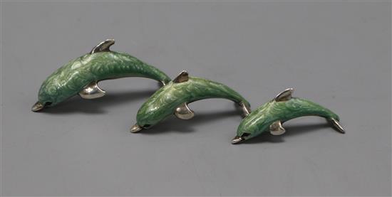 A modern graduated set of three Italian silver and enamel dolphins, largest 53mm.